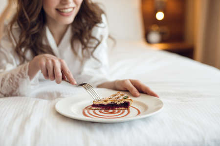 Young girl eating breakfastの写真素材