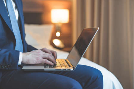 Young businessman with a laptopの写真素材