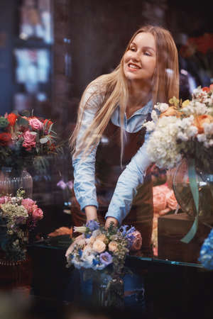 Smiling florist in uniform