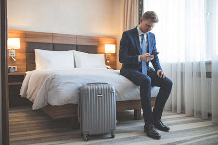 Young businessman in the hotelの写真素材
