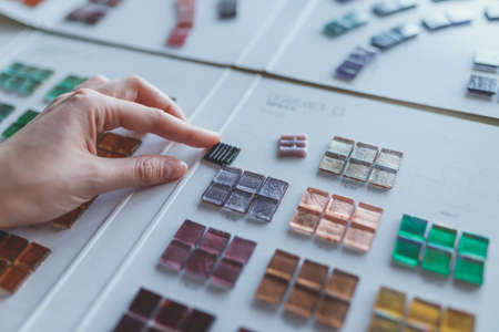 Human hands with mosaicsの写真素材