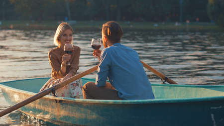 Attractive couple with glasses in a boat