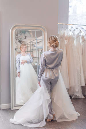 Attractive young woman at the mirrorの写真素材