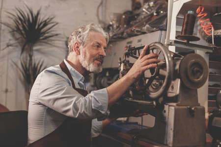 Elderly man at the factoryの写真素材