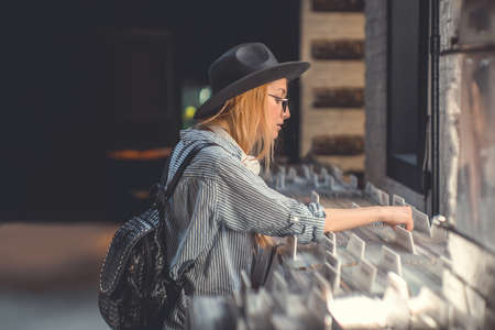Young attractive girl browsing records