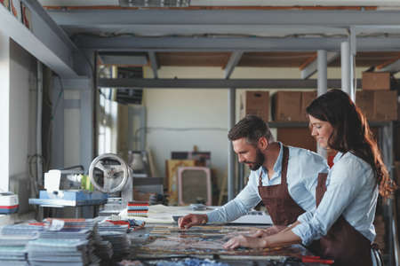 Young people in apronsの写真素材