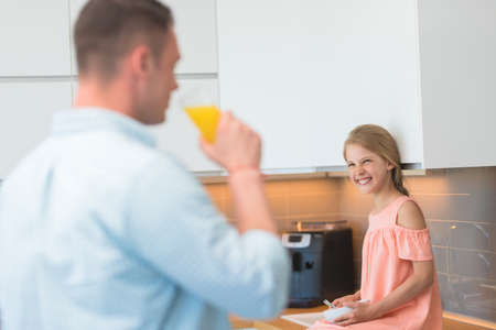 Young family having breakfast at homeの写真素材