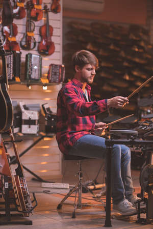Young musician playing the drums