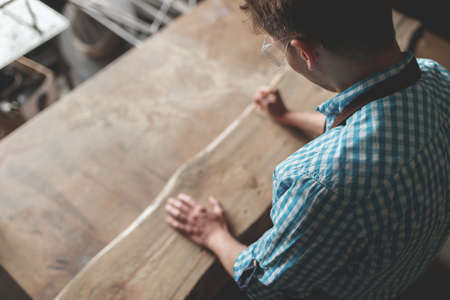 Young carpenter in studioの写真素材