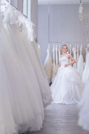 Smiling beautiful bride in a wedding storeの写真素材