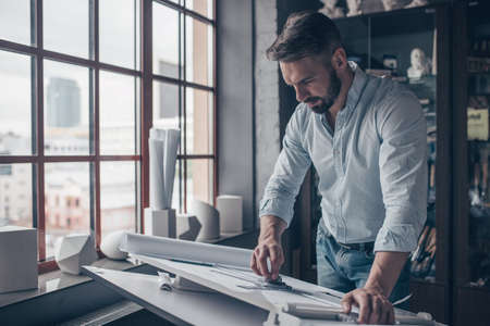 Mature architect with drawing
