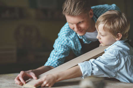 Dad and son at workの写真素材