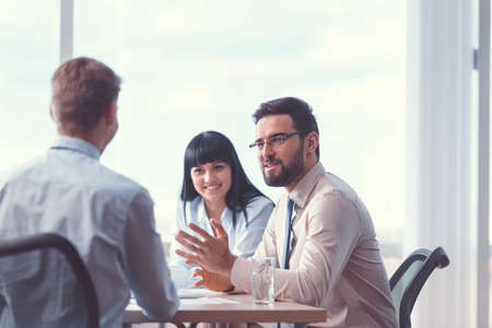 Smiling business people at meetingの写真素材