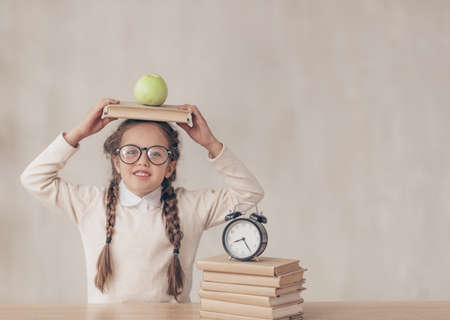 Smiling little pupil in the studioの写真素材