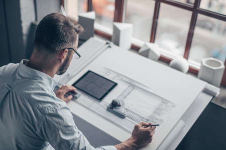 Mature man with a tablet