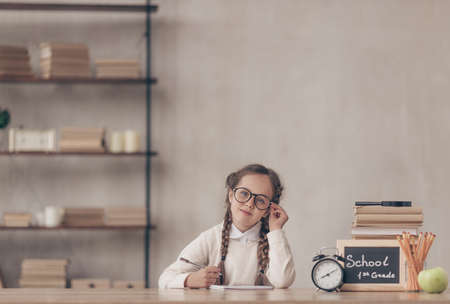 Little pupil with eyeglassesの写真素材