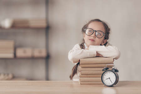 Dreaming little pupil in studioの写真素材