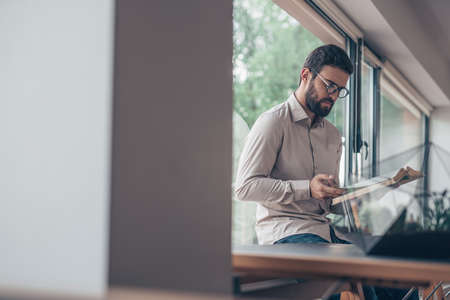 Young student reading a book