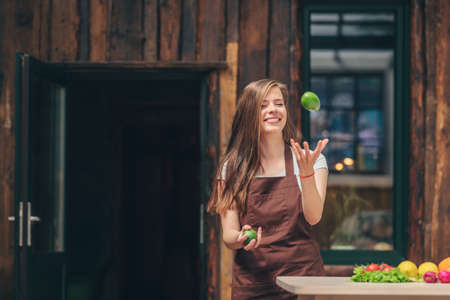 Young girl in the kitchenの写真素材