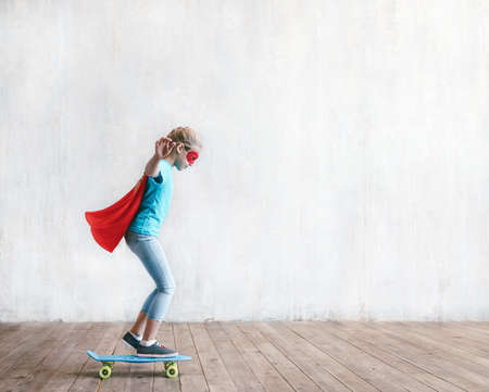 Little girl skating in studio