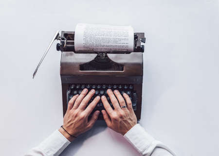 Typing young writer close upの写真素材