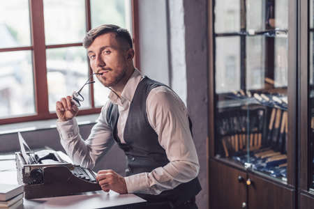Looking young writer in the office