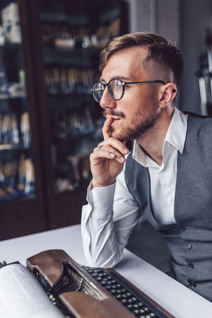 Thinking man at work in the officeの写真素材