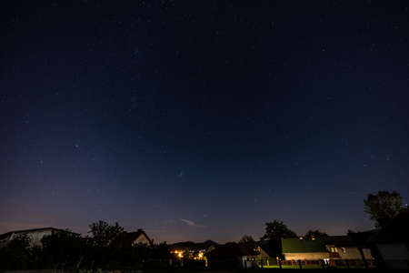 Night starry sky over the city
