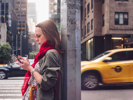 Attractive girl with a phone in New York