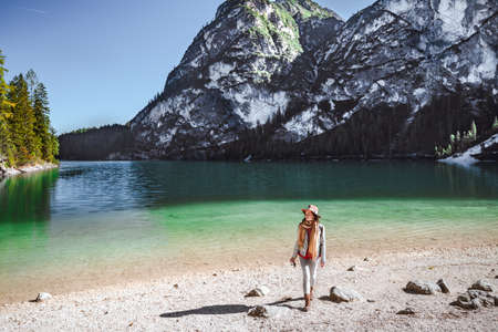 Young photographer with a camera at Lake Braies