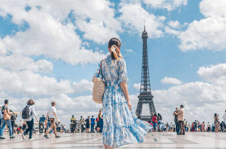 Attractive girl in a dress in Paris on vacationの写真素材