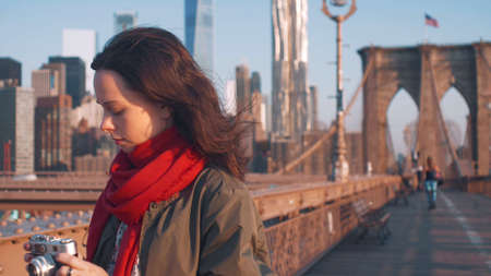 Young woman on the Brooklyn Bridge in New York City