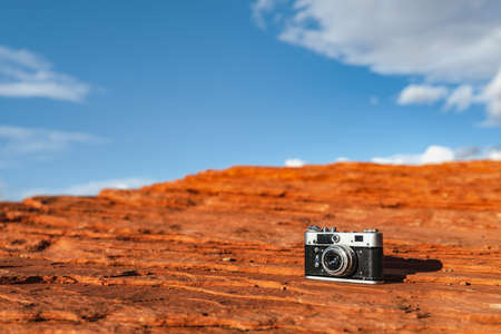 Retro camera on a rock in Glen Canyonの写真素材