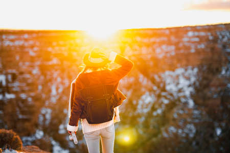 Young woman in the sunset at the Grand Canyon, USAの写真素材