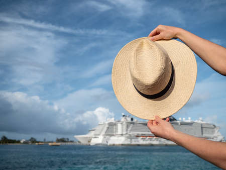 Women's hat on a background of a white ship in summerの写真素材