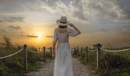 Young woman on the beach in Miami at sunset