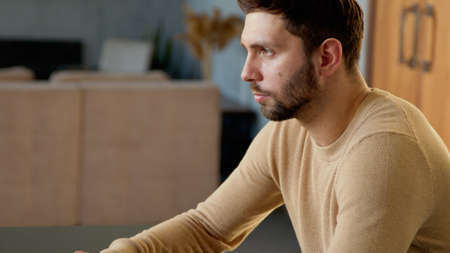 Serious young man thinking about a new idea for your businessの写真素材