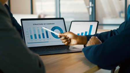 Business people meeting brainstorming ideas about new project. Young colleagues working together planning success strategyの写真素材