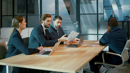 Young people communicating via video call in the office. business people at the desk in the officeの写真素材