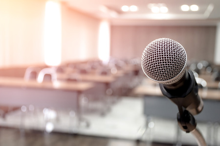 Microphone on abstract blurred of speech in seminar roomの写真素材