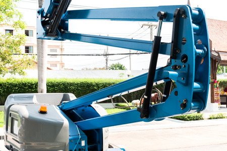 High-rise building maintenance engineers using cranesの写真素材