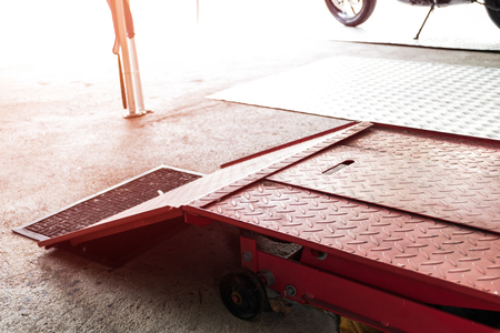 motorcycle lift garage for maintenance checks and repair serviceの写真素材