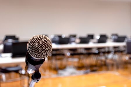 Microphone and Notebook on abstract blurred of speech in seminar roomの写真素材