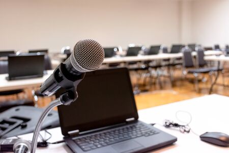 Microphone and Notebook on abstract blurred of speech in seminar roomの写真素材