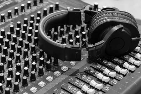 Close up headphone on mixer audio (black and white color)
