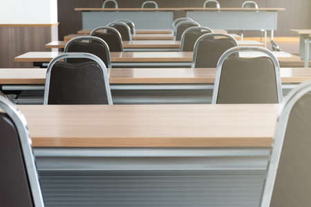 Close up the chair in in seminar room with a speaker table in the middle of the stageの写真素材