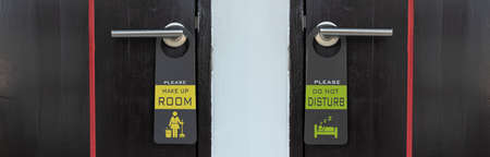 Close up of the sign, Please make up room and do not disturb on door handleの写真素材