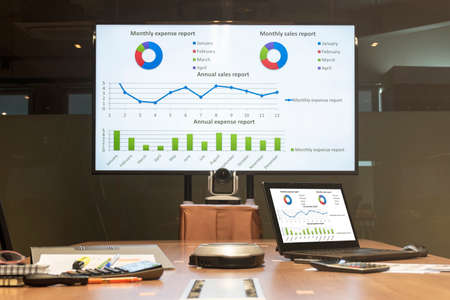 Laptop and meeting equipment on table with presentation meeting