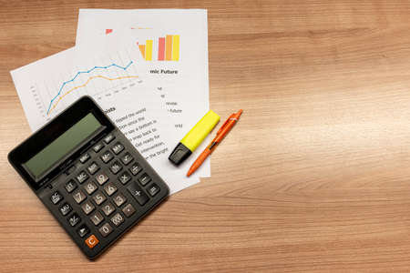 Calculator, pen, pencil, notebook,  on the tableの写真素材