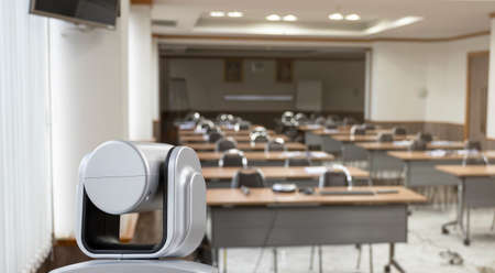 Close up behind camera video conferencing in online seminar roomの写真素材
